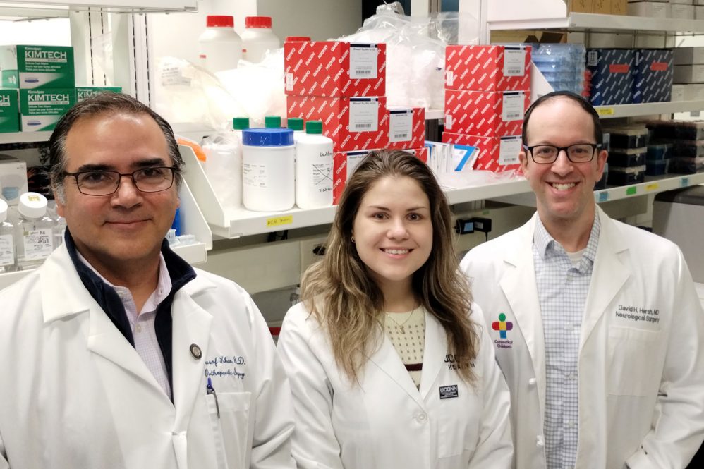 From left: Yusuf Khan, Hanna Anderson, and Dr. David Hersh in Khan's lab at UConn Health (Photo by Chris DeFrancesco)