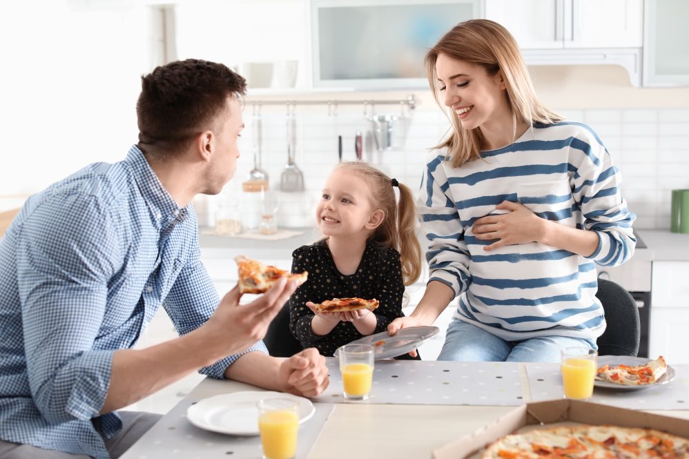 family of three eating breakfast
